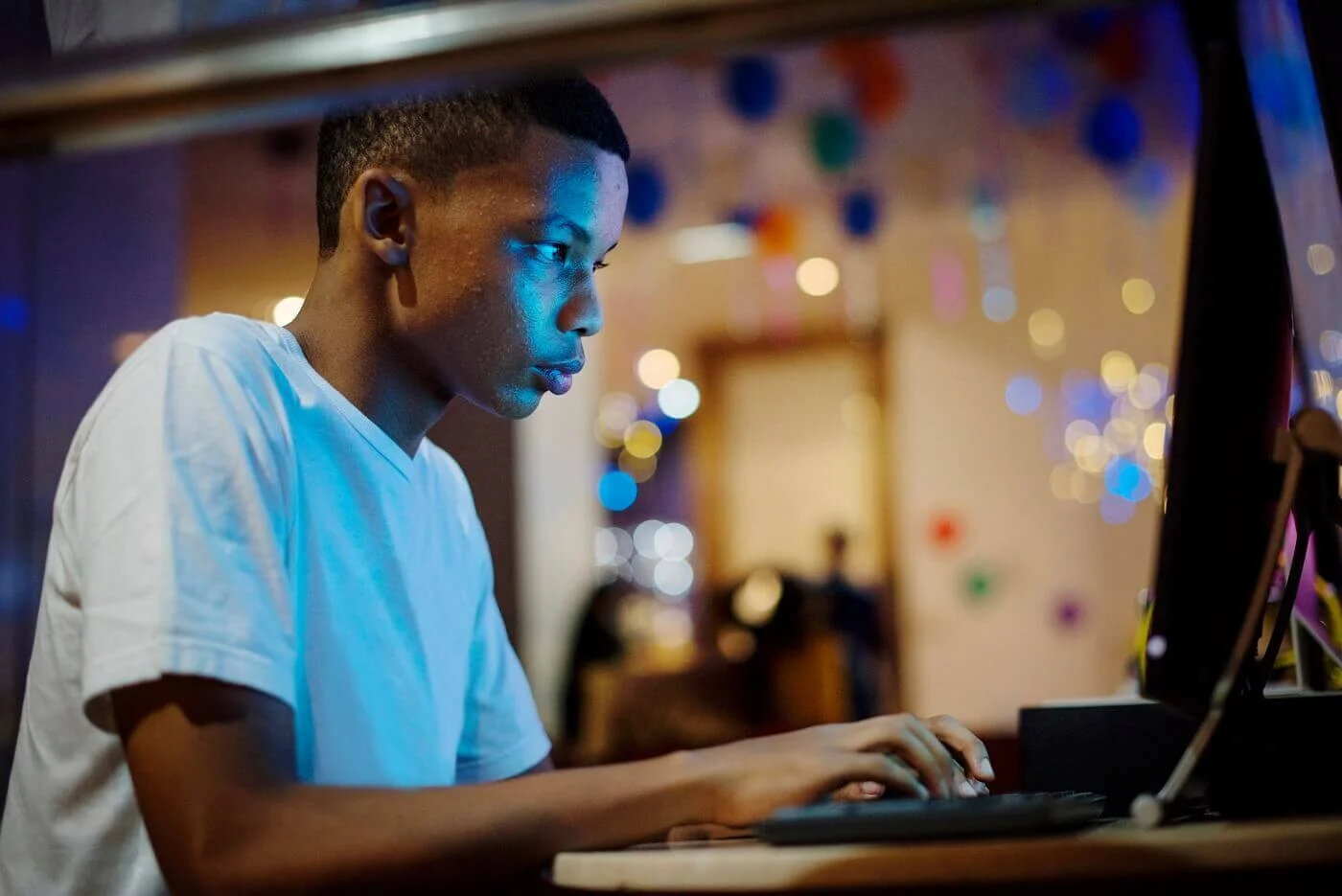 american boy using a computer Top Jobs for 12 Year Olds: Fun Ways to Earn Money and Gain Experience